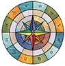 The Charmed Compass logo showcasing the natal chart house configuration of the Astrologer Joeii Starr and the middle of the chart is a compass adorned with chakra colors, loaded with symbolism.